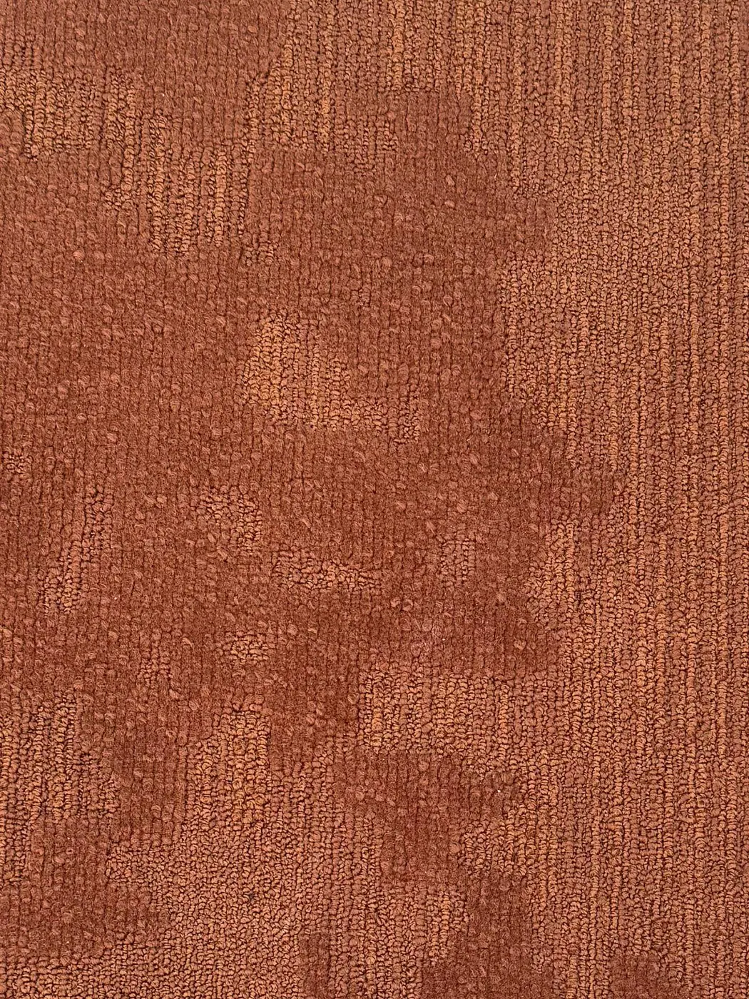Light grey striped carpet tile close-up