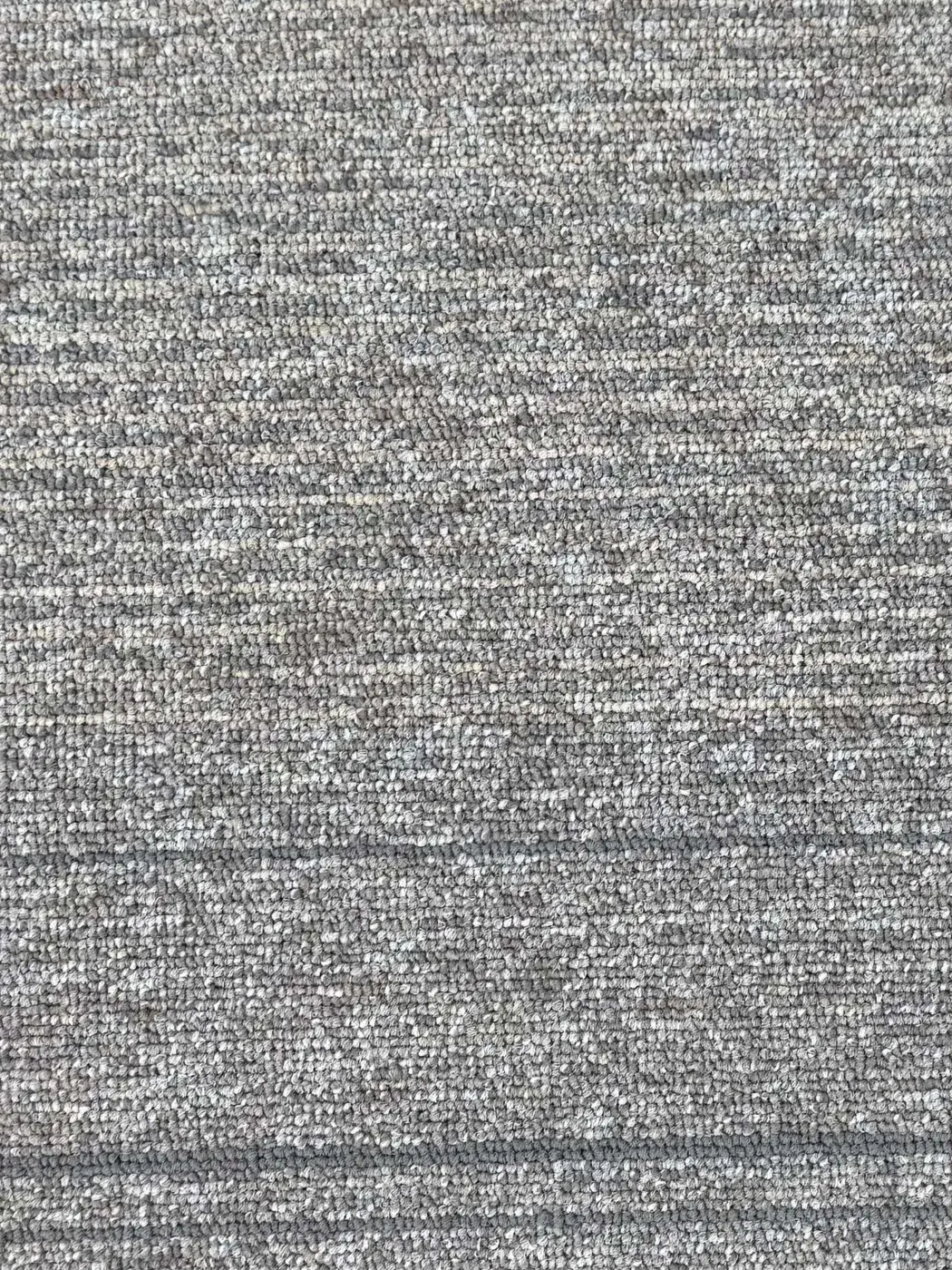 Blue-grey striped carpet tile close-up